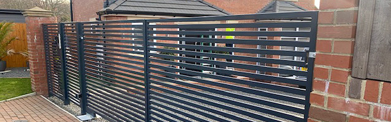 Contemporary Automated Gates with Matching Pedestrian Entrance